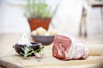 Rolled shoulder of lamb with rosemary — Stock Photo