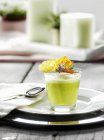 Glass of green asparagus soup — Stock Photo