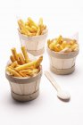 Potato fries in mini wooden buckets — Stock Photo