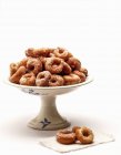 Deep-fried carnival treats from Neaples on cake stand over white surface — Stock Photo