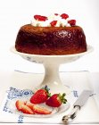 Closeup view of Bab cake with strawberries and cream — Stock Photo