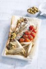 Fried fish with chicory and cherry tomatoes — Stock Photo