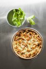 Top view of Quiche Lorraine with fish and herb — Stock Photo