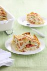 Portions of lasagne with ham — Stock Photo