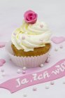 Wedding cupcake decorated with marzipan rose — Stock Photo