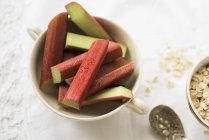Pieces of rhubarb in cup — Stock Photo