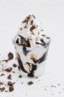 Frozen yogurt with chocolate sauce — Stock Photo