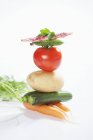 Stack of vegetables on white background — Stock Photo