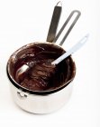 Chocolate glaze in saucepan — Stock Photo