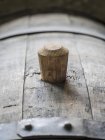 Closeup view of an oak barrel with a wooden bung — Stock Photo