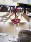 Pouring Saperavi red wine in glass — Stock Photo