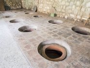 Kvevri buried amphorae in a wine cellar — Stock Photo