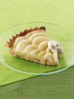 Slice of apple tart with cream — Stock Photo