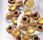 Various Danish pastries served with coffee — Stock Photo