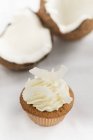 Cupcake topped with coconut cream — Stock Photo