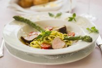 Pork medallions with noodles — Stock Photo