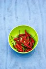 Fresh red chilli peppers — Stock Photo
