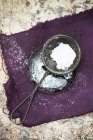 Sieve with icing sugar — Stock Photo