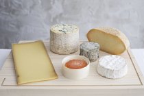 Various Cheese on Breadboards — Stock Photo