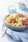 Fusilli pasta with chicken and tomatoes — Stock Photo