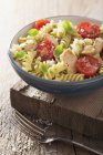 Fusilli pasta with chicken and tomatoes — Stock Photo