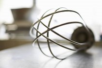 Closeup view of one metal whisk — Stock Photo