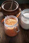 Elevated view of an arrangement of red lentils and wholemeal flour — Stock Photo