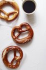 Pretzels and a cup of coffee — Stock Photo