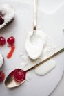 Icing sugar and glace cherries — Stock Photo