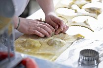 Chef making ravioli pasta — Stock Photo