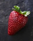 Closeup view of one ripe juicy strawberry — Stock Photo