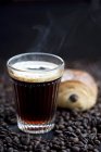 Glass of Coffee and chocolate croissant — Stock Photo