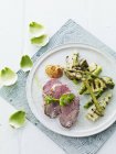 Roast lamb with grilled artichokes — Stock Photo