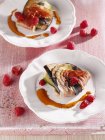 Aubergine and courgette saltimbocca with raspberries on white plate — Stock Photo