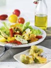 Salad Nicoise with artichokes and tomatoes — Stock Photo