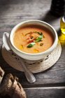 Tomato soup with pesto and basil — Stock Photo