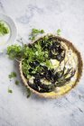 Ramps tart with wild leek over grey marble surface — Stock Photo