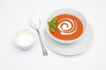 Cream of tomato soup with sour cream — Stock Photo
