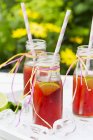 Bottles of iced tea with lime — Stock Photo
