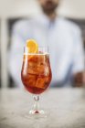 Closeup view of Aperol Spritz in glass on marble table — Stock Photo