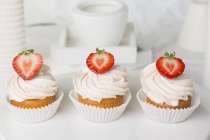 Strawberry cupcakes topped with buttercream — Stock Photo