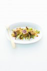 Tuna fish on vegetables — Stock Photo