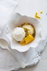 Coconut ice cream with passion fruit sauce — Stock Photo