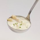 Cream of asparagus soup with chopped parsley — Stock Photo