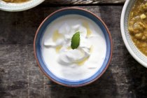 Top view of Raita with a mint leaf in a ceramic bowl — Stock Photo