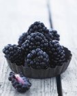 Blackberries in metal cup — Stock Photo