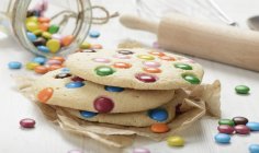 Cookies with coloured chocolate beans — Stock Photo
