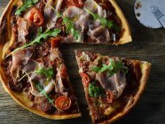 Pizza with Proscuitto and arugula — Stock Photo