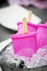 Closeup view of zinc tub filled with crushed ice and ice lolly makers — Stock Photo