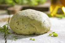 Pasta dough with oregano — Stock Photo